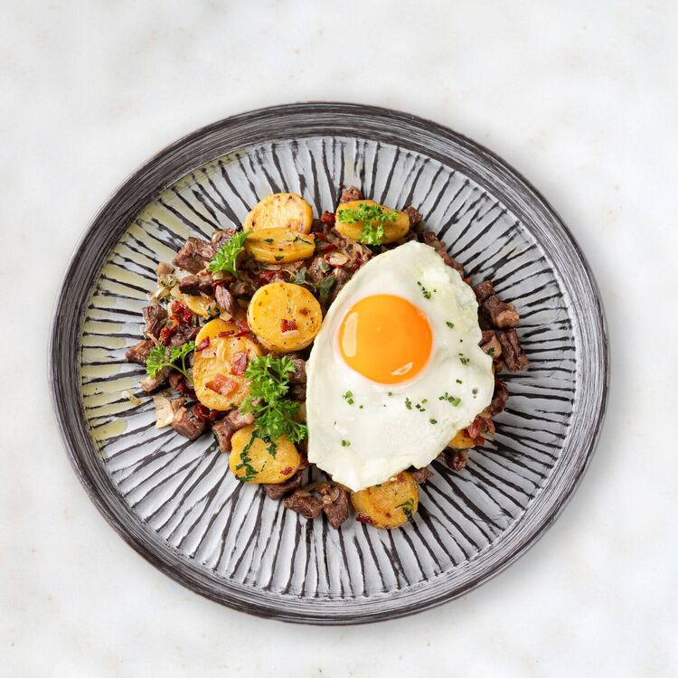 Plate with Tyrolean Gröstl and fried egg